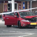 Man arrested after car crashes into Greenock Tesco